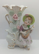 Vintage porcelain bud vase or planter featuring a girl playing a lute