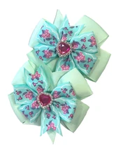 Beautiful Flowers with a faux diamond heart center inspired pigtail bows.