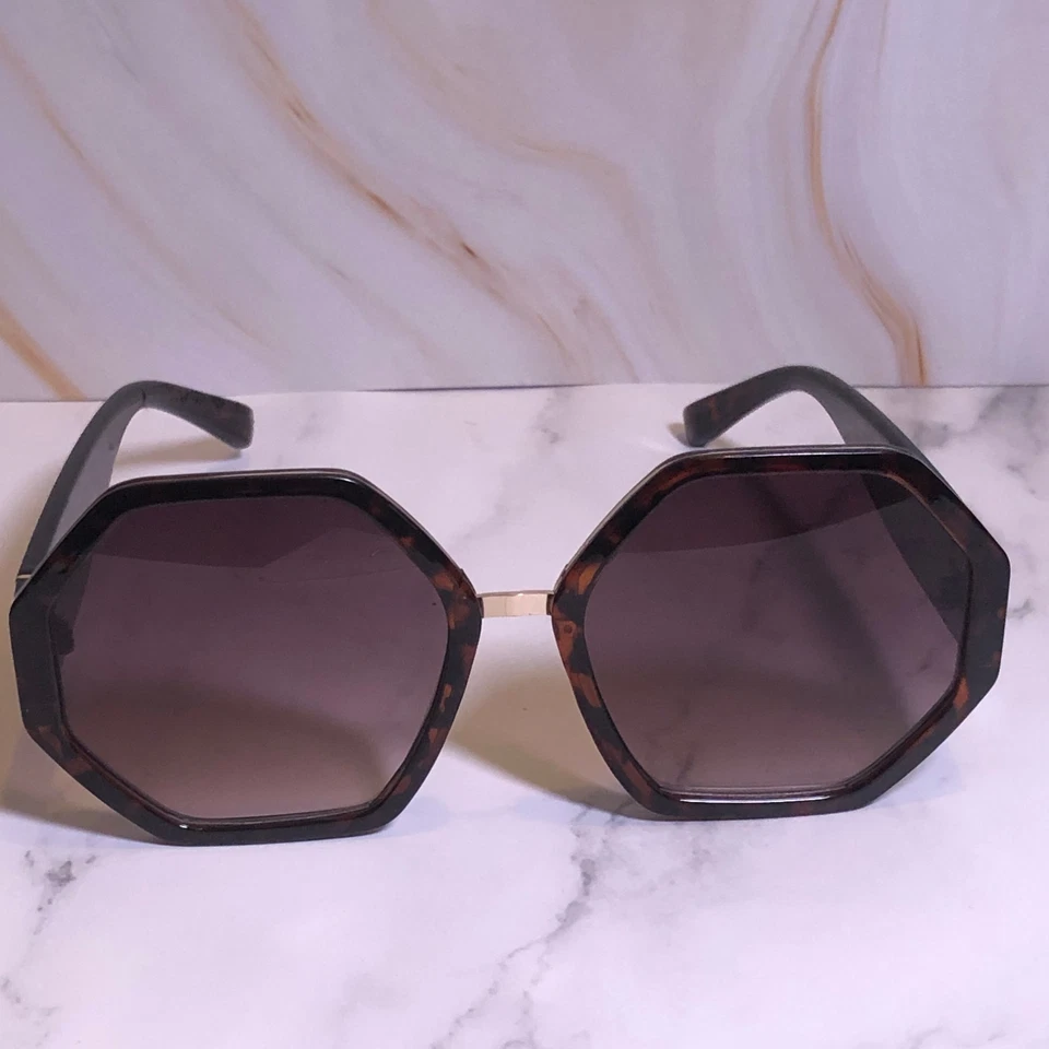 Gafas de sol retro Aldo para mujer marrón tortuga marco hexagonal patrón de panal Foto 2 de 4