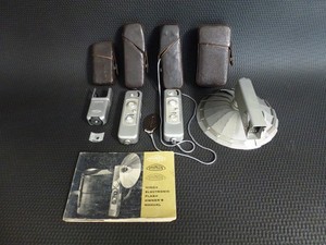 2 Minox B Cameras, 2 Minox Flashes, Cases & Book in Working Condition