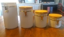 Set of 4 Ceramic Canisters w,/Stay Fresh Seals Wood Lids
