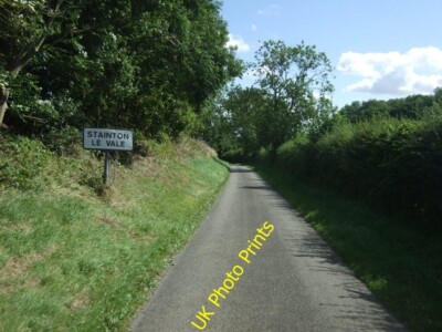 Photo 6x4 Entering Stainton le Vale Heading north east. c2015