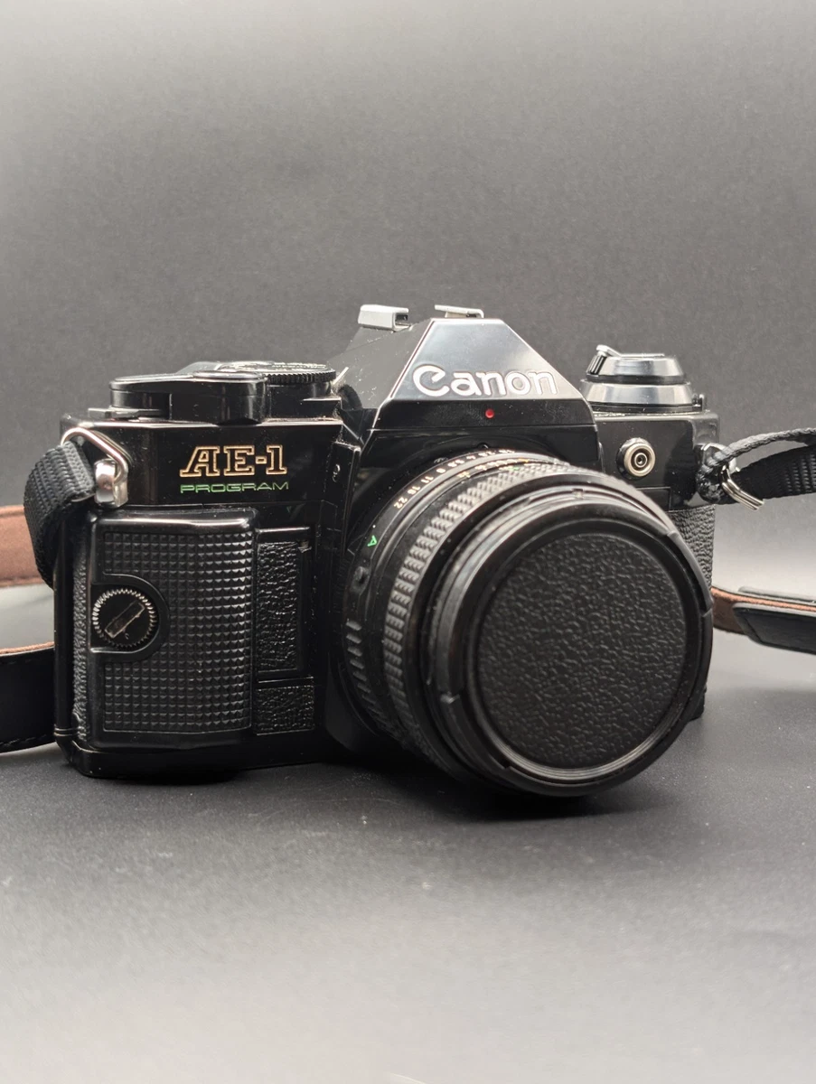 Programa Canon AE-1 negro con FD 50mm F1.8 de JAPÓN - Vendedor del Reino Unido. Película probada