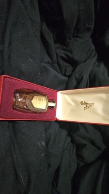 Jean D'albret Ecusson parfume 5/8 fluid ounce bottle with a red velvet case.
