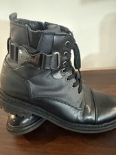 Durable and stylish boots with a lace-up front and side zipper for convenience.