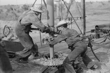 8" x 10"  Oil Workers Working on Lowered Traveling Block, Seminole Oil Field