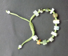 Natural Jade 12 bead bracelet on green drawstring - VGC