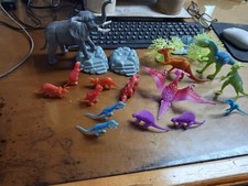 Plastic Dinosaur Figures, Lot of 14 and 1 elephant 2 trees and 3 rock formations