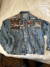 Vintage Jordache denim jacket with a distinctive Southwestern-style woven patch