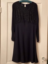 CAROL LITTLE BLACK DRESS WITH BEADED TOP. A LINE BOTTOM. SHEER SLEEVES. SIZE 12.