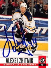 Alexei Zhitnik autographed Hockey Card (Buffalo Sabres, SC) 2003 Pacific #46