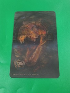JURASSIC PARK, THE LOST WORLD. 1997 U.C.S & AMBLIN LENTICULAR 3-D T-REX STICKER