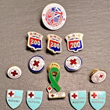 14 AMERICAN RED CROSS PINS : 200, HOME NURSING, LIFE SAVING JR+ H659