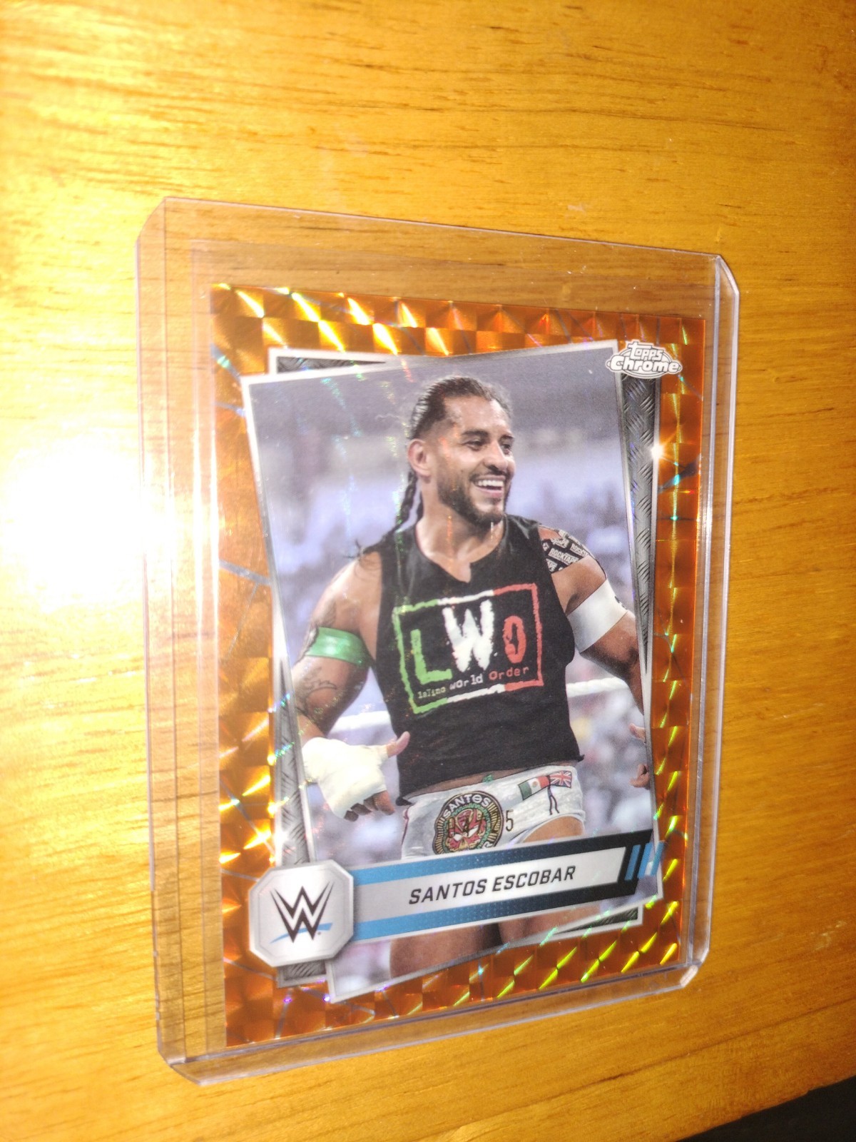 2025 Topps Chrome WWE Santos Escobar Orange Geometric Refractor 04/25 #60