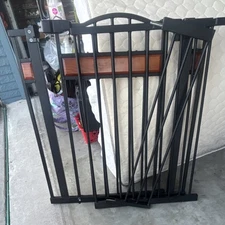 Adjustable Expandable Black Metal Doorway Gate with Brown Accents
