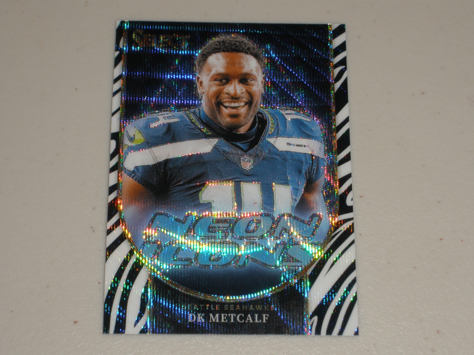 2023 Panini Select Neon Icons Zebra Prizm #DKM DK Metcalf