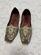 Indian Jutti or Mojari shoes, intricate embroidery pointed, curled toe design.