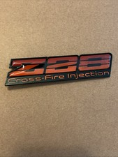 1982-1984 Camaro Z28 Cross-fire Injection Dash Emblem 14044458 Red Oem Gm 1982-1984 Camaro Z28 Cross-fire Injection Dash Emblem 14044458 Red Oem Gm