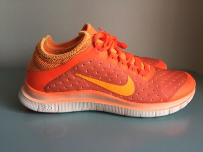 orange neon nike shoes