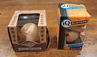 Wooden circle puzzles IQ Busters Tormentor & True Genius Aztec Sun Stone in box