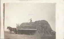 RPPC Britton South Dakota Farm Scene Man atop 20-ft. Hay Pile c. 1910