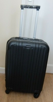 small black suitcase on wheels