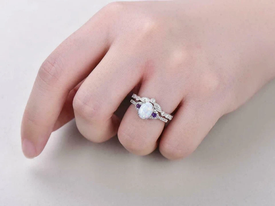 Juego de anillos de boda de ópalo de fuego ovalados de oro blanco de 14 k de 3 quilates Foto 2 de 3