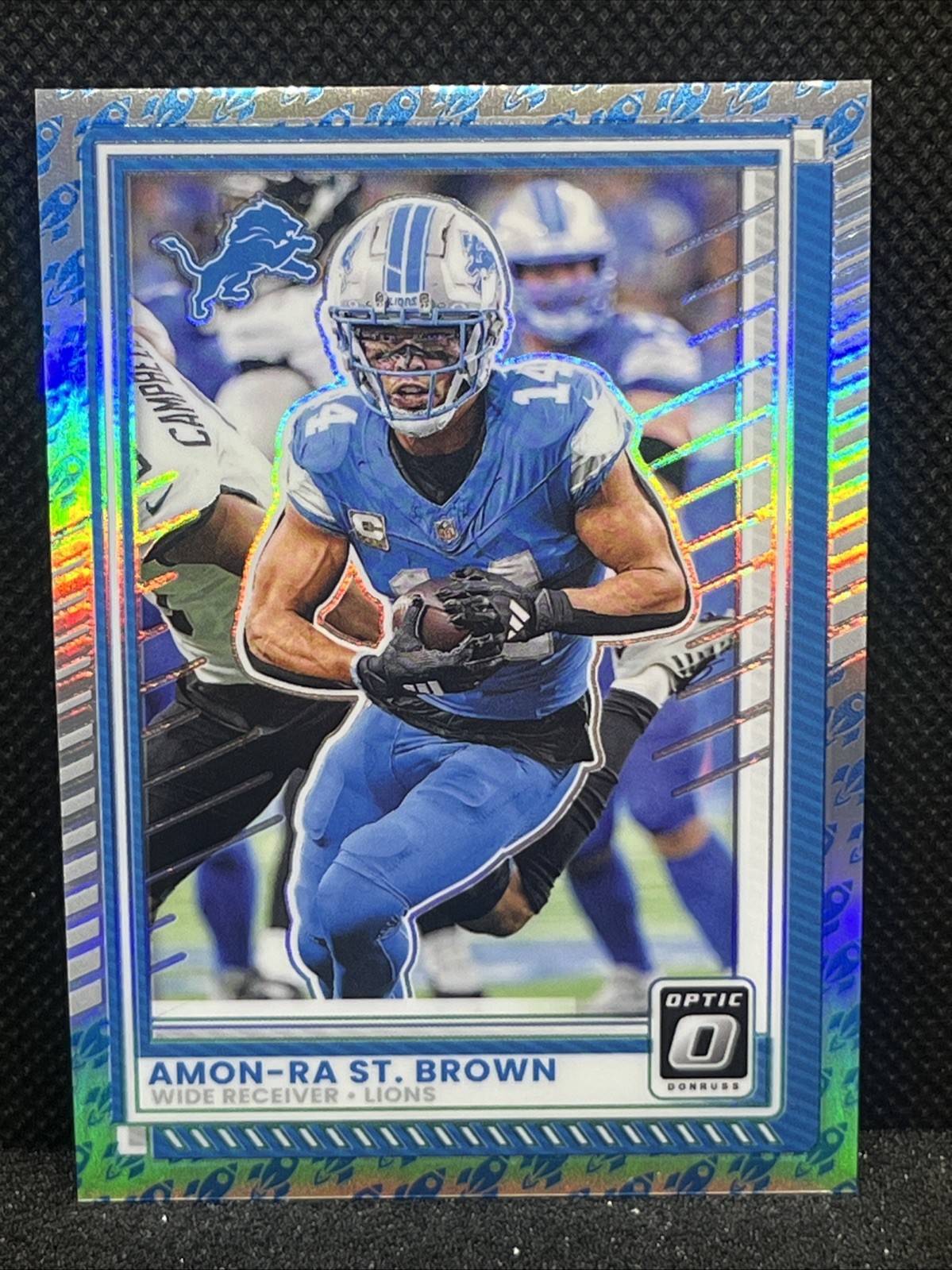 2025 Donruss Optic Football Amon-Ra St. Brown Rocket Emoji Prizm #63 Lions