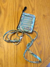Vera Bradley Zip ID Case and Lanyard features a clear front window and a vibrant