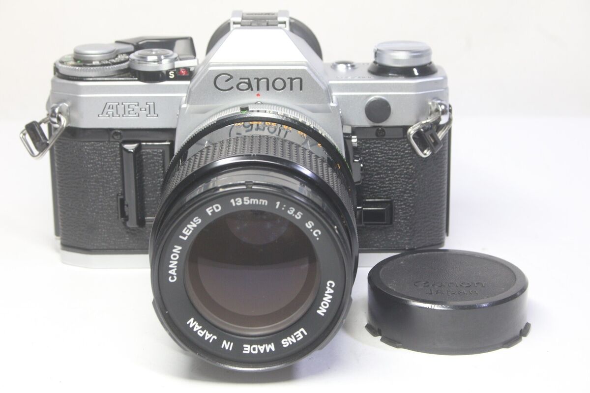 Canon AE-1 SLR 35mm Film Camera Silver + FD 135mm F/3.5 S.C Canon AE-1 SLR 35mm Film Camera Silver + FD 135mm F/3.5 S.C