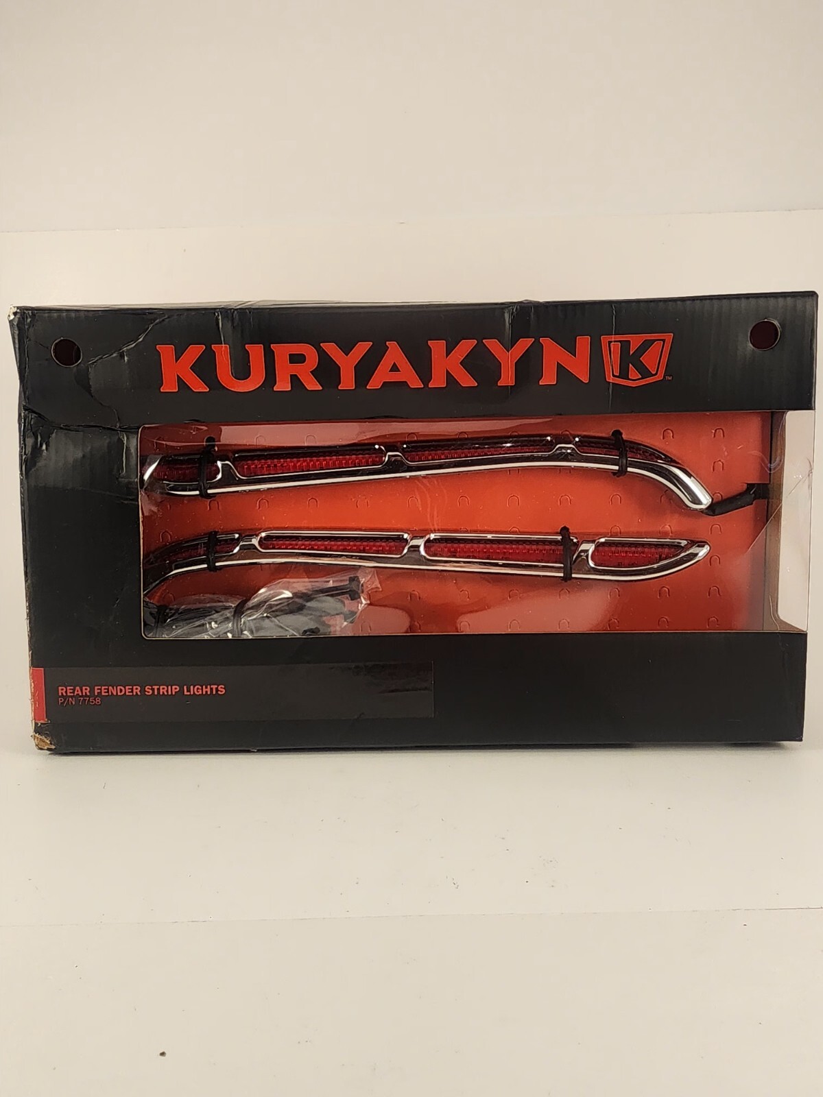 The Kuryakan 7758 rear fender strip lights are gently curved chrome housings...