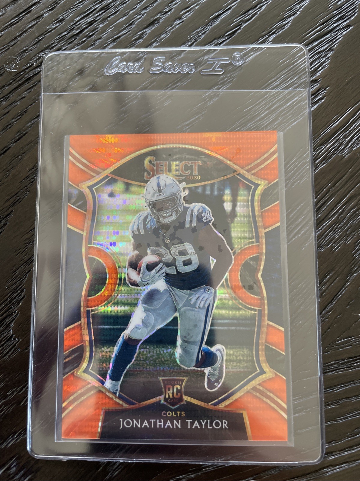 2020 Panini Select - Concourse Jonathan Taylor Neon Orange Pulsar Prizm /7 (RC)