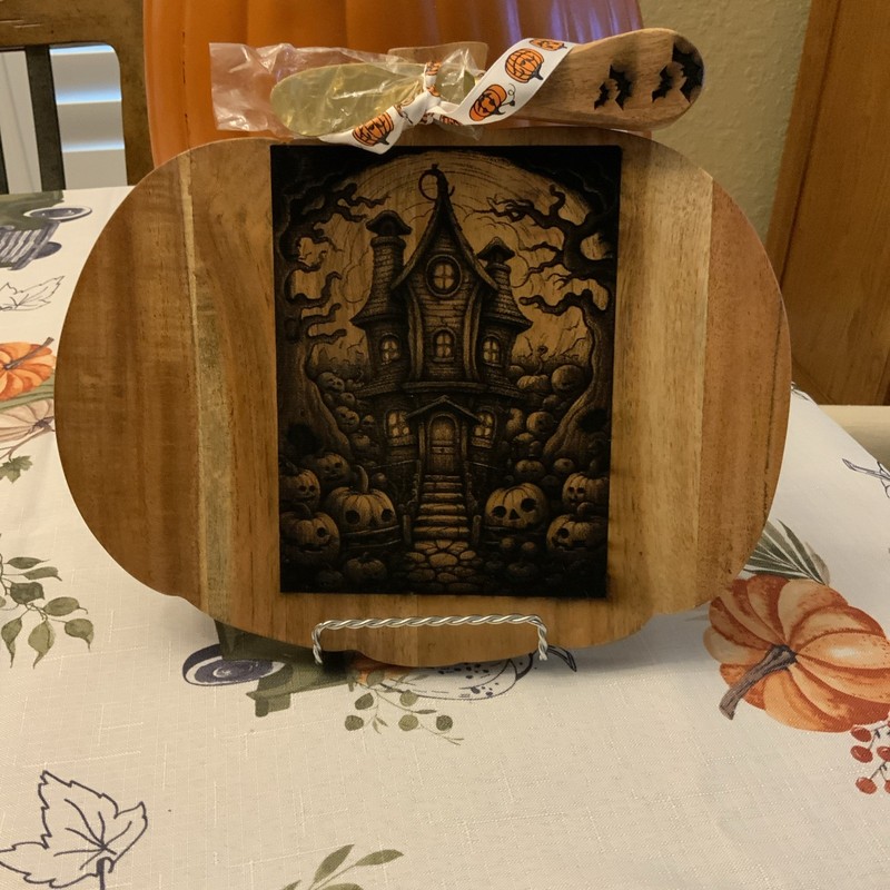 Halloween Pumpkin Charcuterie Board Featuring a Haunted House 