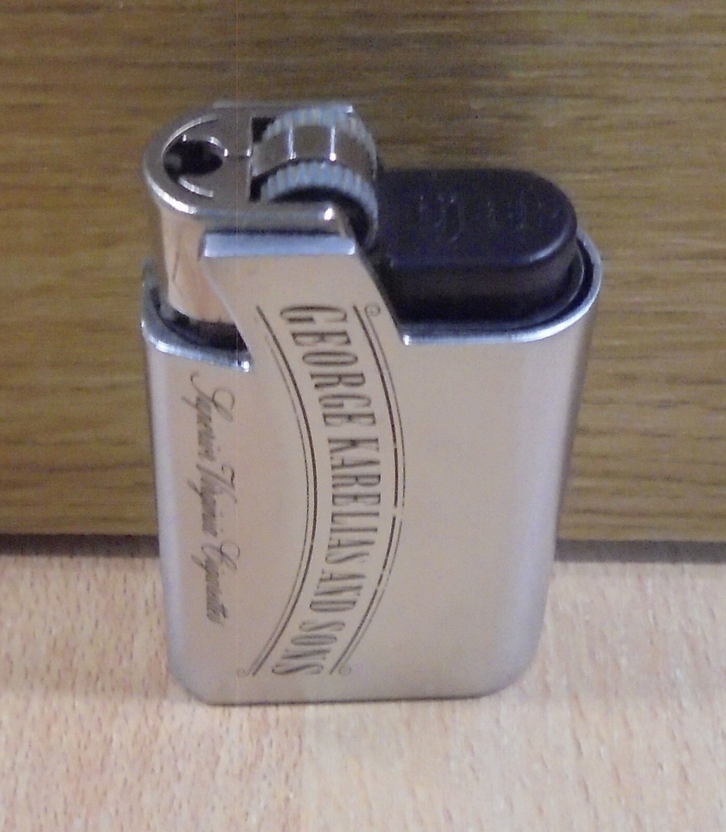 GEORGE KARELIAS & SONS CIGARETTES METAL LIGHTER CASE WITH EMPTY LIGHTER