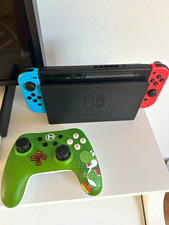 Nintendo Switch 32GB mit Dock, Joy-Con Rot/Blau + grüner Controller