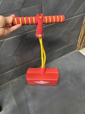 Small Child’s Red And Yellow Pogo Stick