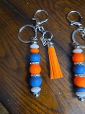 GRADUATION KEYCHAINS 7 EACH. CAN DO ALL COLORS. WRISTLETS 10
