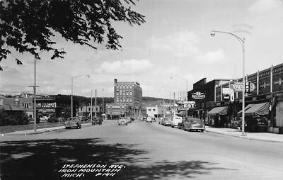 J77/ Iron Mountain Michigan RPPC Postcard c40-50s Main Street Stores 262