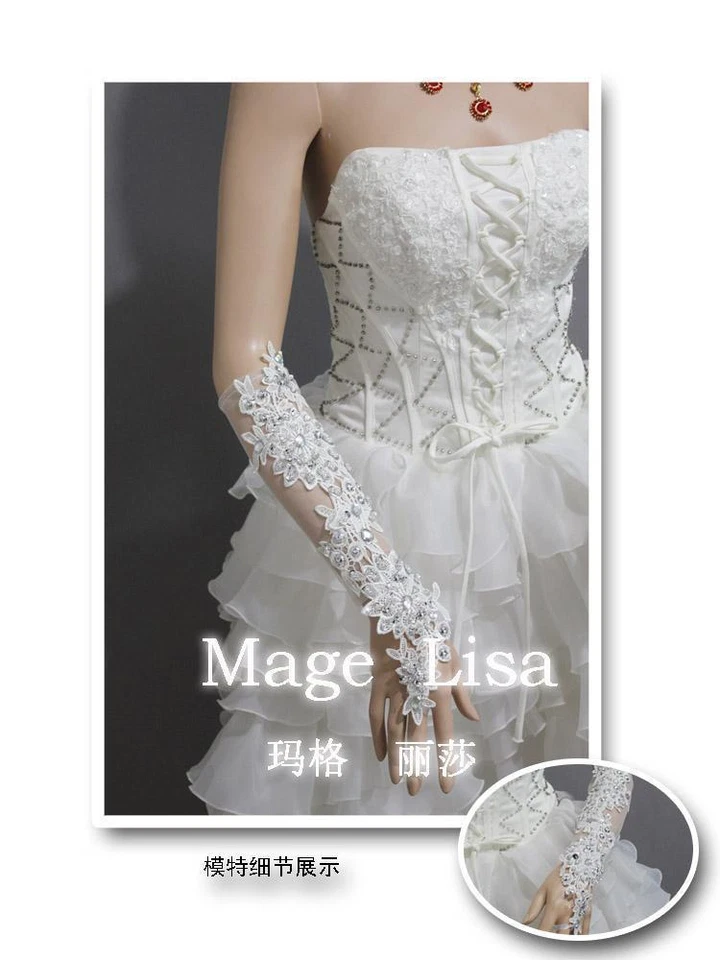 Moda Guantes de boda nupciales blancos sin dedos de encaje con cuentas a mano con pedrería Foto 2 de 2