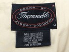 White Faconnable vest, medium, with black text, red oval label, and care instructions.