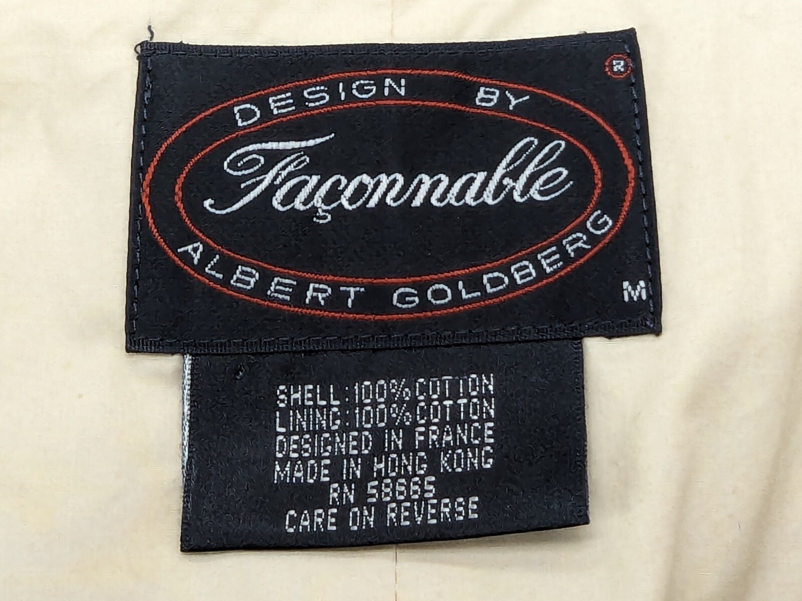 White Faconnable vest, medium, with black text, red oval label, and care instructions.