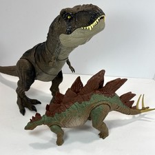 Jurassic World Toys- Thrash  N Devour T Rex/Action Attack Stegosaurus- Read