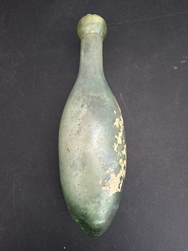 Antique Green Glass Torpedo Bottle With Stuff Inside