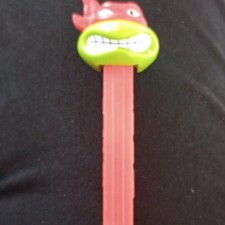 PEZ Cartoon Character Dispenser Green Head w/ Red Hat, Red Stem, Slovenia