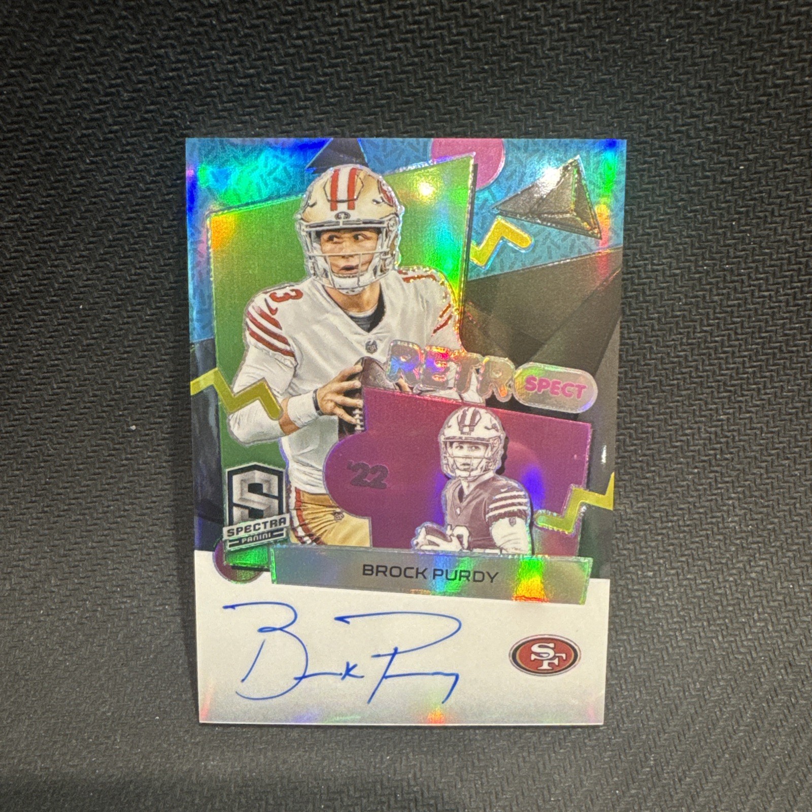 Brock Purdy #6 Football Cards 2023 Panini Spectra RetroSpect Autograph trading card — raw and PSA graded price guide