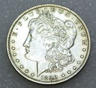 1890-O Morgan Silver Dollar AU with some luster in saflip #P362