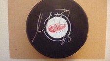 Moritz Seider AUTOGRAPHED Detroit Red Wings Hockey Puck Signed