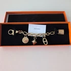 Hermes Amulette 4 Gold bag charm Cadena Breloque Olga 002