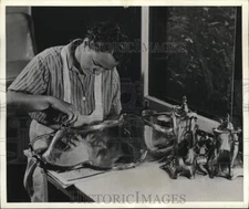 1941 Press Photo Female house worker polishes silver tray - piw15687