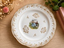 J.V. Assiette décorative en porcelaine décor doré scène galante couple